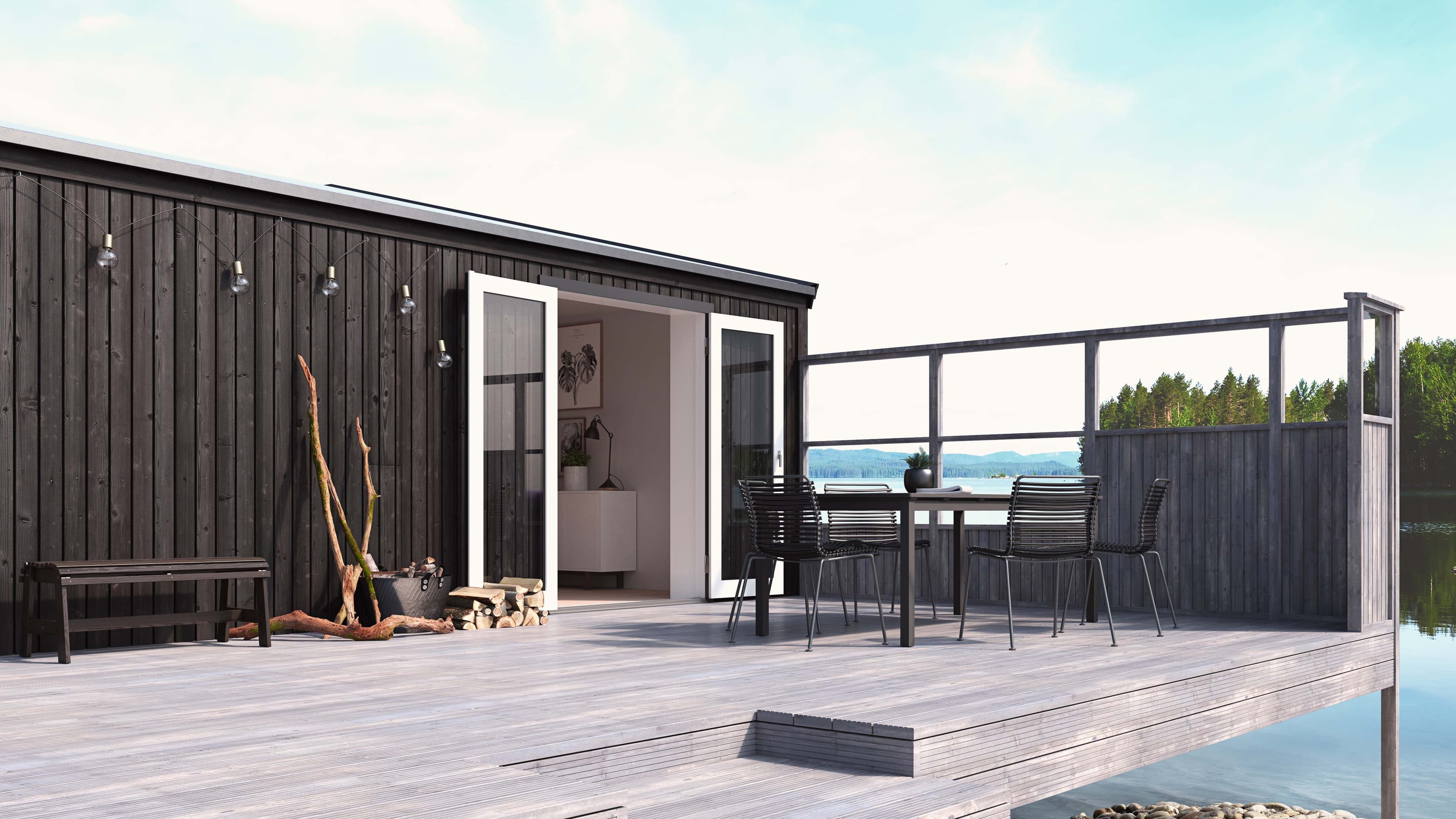 Terrasse ved vannet med levegg.