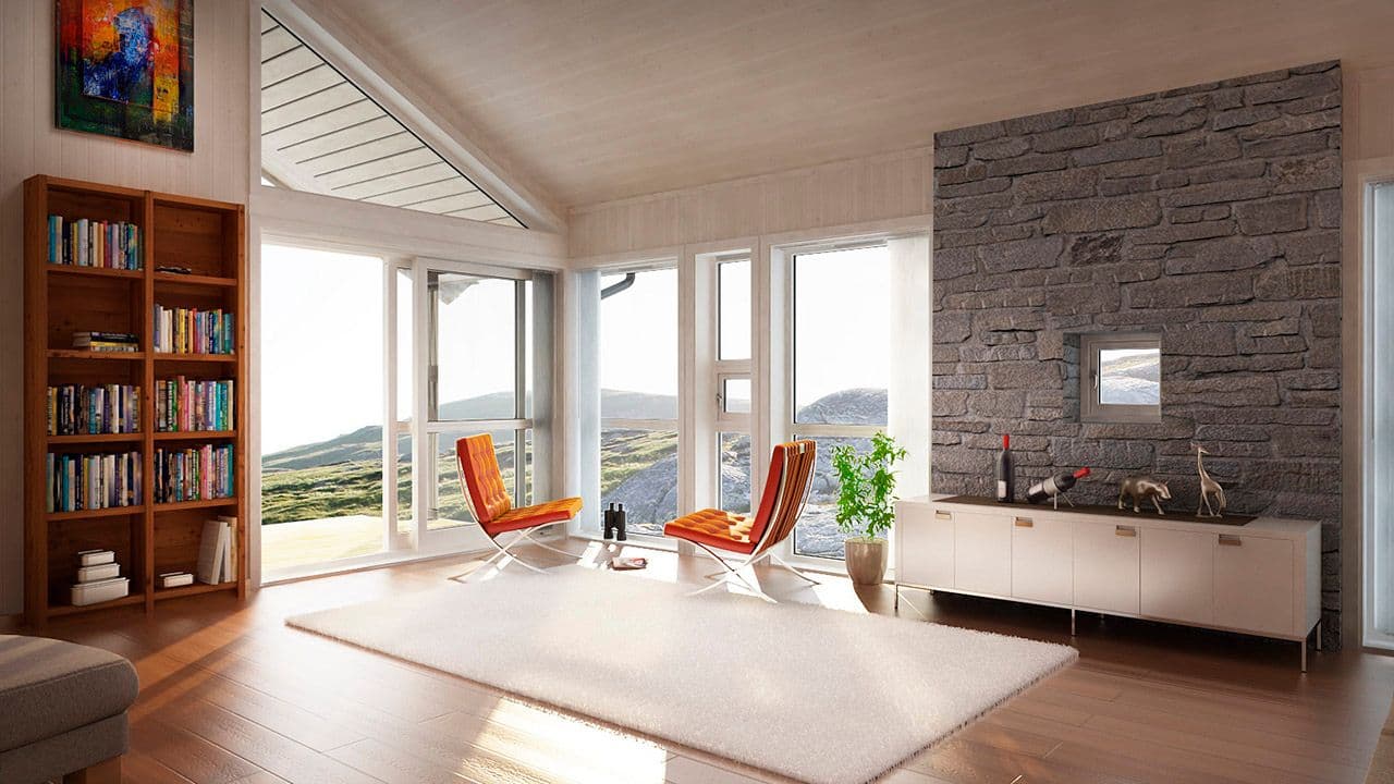 Stue med store vinduer og murvegg.